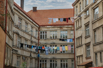 Fototapeta premium Courtyard of an old house with laundry drying on a line