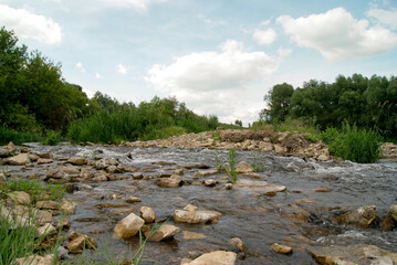 River Flowing Through Rocky Landscape