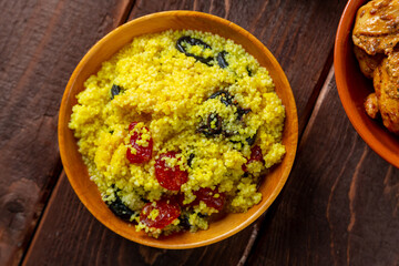 couscous stewed vegetables with meat and spices on the festive table