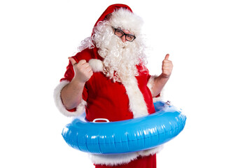 Vacations and holidays. Funny fat Santa Claus with an inflatable ring posing on a white background.