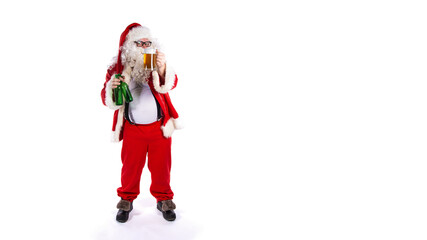 Vacations and holidays. Funny fat Santa Claus drinking beer and posing on a white background.