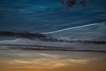Zoomed-in view of noctilucent clouds (NLC) with an exceptionally bright waving stripe
