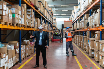 Innovative Industrial Inspection: Businessman Utilizing Virtual Reality Headset  for Warehouse Monitoring