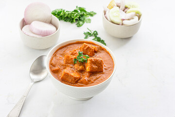 Paneer Butter Masala, Indian Cottage Cheese Curry with Butter and Cream Garnished with Cilantro