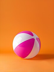 Magenta and White Beach Ball on an orange Background. Summer Wallpaper