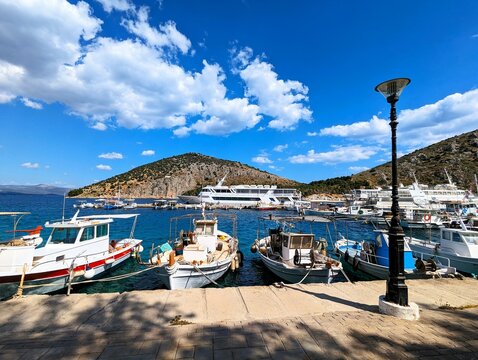 Small boat harbor in the vacation resort of Tolo in Greece on a sunny day in summer