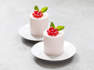 Red Currant Cream pudding cylindrical shape. Close-up