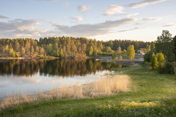 A lake with a house in the background