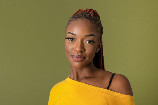 Smiling black woman in studio
