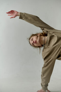 young woman performing on a white background