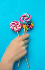 Color lollipop, spiral candy on stick, colorful striped lollypop, round fruit caramel, circle lollipop