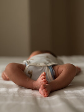 Closeup photo of newborn's legs