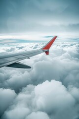 Fototapeta premium Flying Through Clouds. Aircraft Wing in Flight with Escapism and Travel Concept