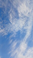 Blue sky with white sparse clouds