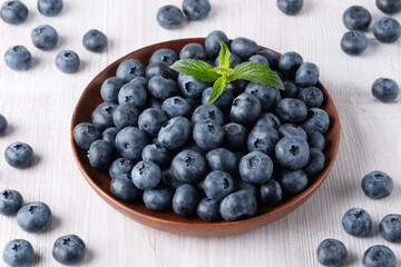 Fresh blueberries on a wooden white table