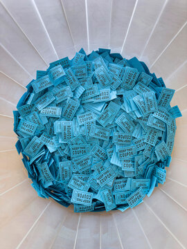 Raffle coupon ticket in container 