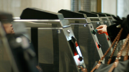 Turnstiles in a subway station. Passengers pay the fare. Control point. Payment system in the underground transport.
