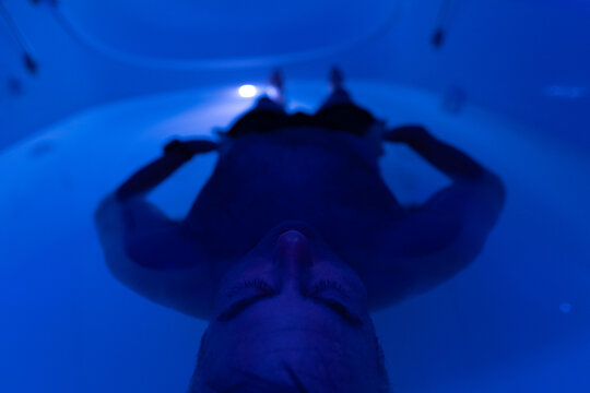 Man's perspective floating in a flotation tank