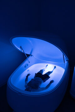 Person floating in sensory deprivation tank