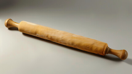 A tool used for flattening dough or pastry. It is a long, cylindrical object with a handle at each end.