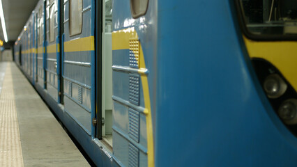 Beautiful new metro train at the station. The subway is waiting for passengers.