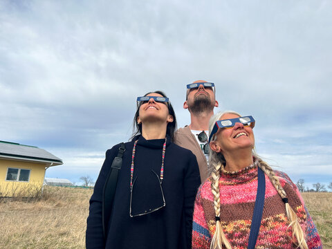 UGC Happy family watching the eclipse
