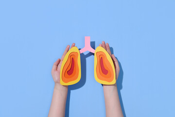 the Lungs done in 3D origami paper cut style in hands