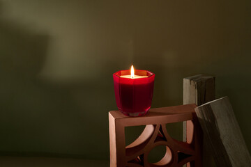 Beautiful burning candle on table