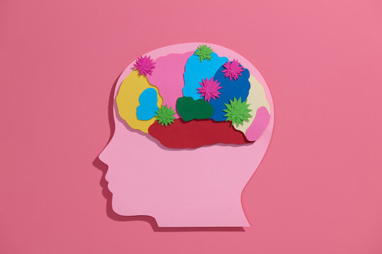 Paper cut style medical background with virus cells attacking a brain