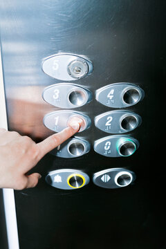 Pressing Elevator Button to First Floor
