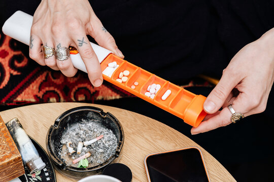 Young Woman Managing Medication and Medical Marijuana for MS