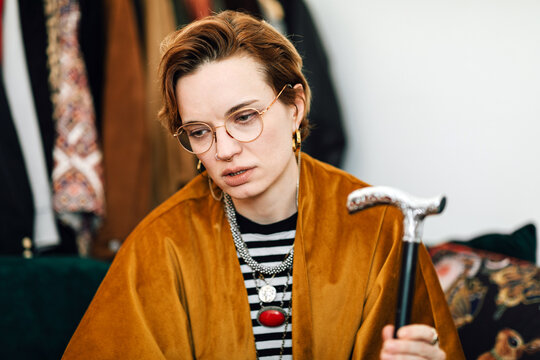 Pensive Young Woman with Walking Cane