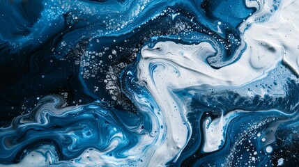 Obraz premium A blue and white ocean with a lot of white paint splatters