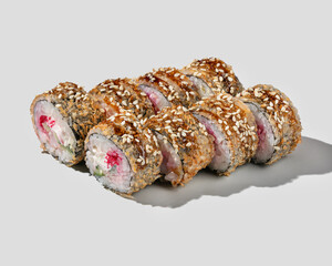 A delicious serving of crispy sushi rolls coated in sesame seeds, perfect for Japanese cuisine enthusiasts and Asian food celebrations
