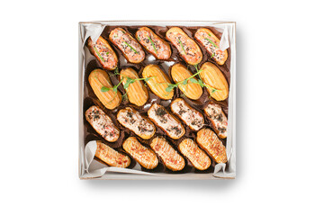 A box of assorted gourmet eclairs, ideal for dessert tables and celebratory events like Christmas or birthdays