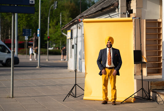 Elegant Indian Man Posing At Studio Background On The Street
