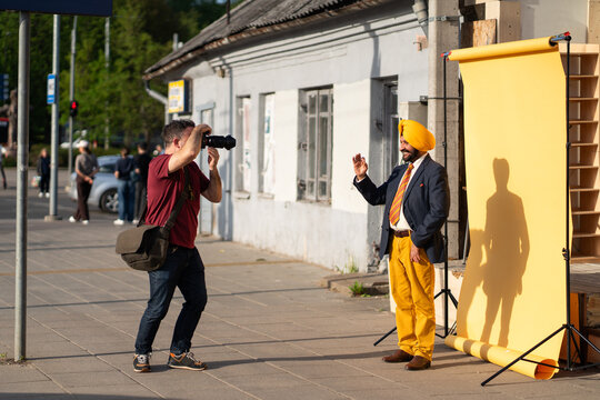 Indian Man Posing For Photographer At Studio Background On The Street