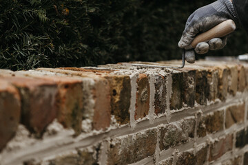 Close-up,Worker's hand laying bricks