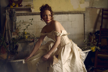 portrait of a young woman in dress in the bathroom