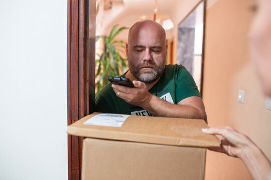 woman recieve delivery package from clothes online shop 