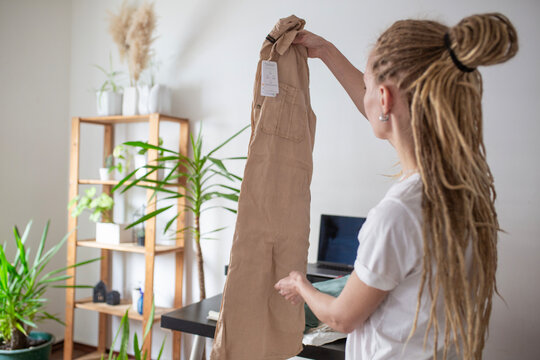 woman recieve delivery package from clothes online shop 