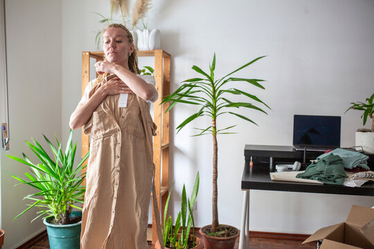 woman recieve delivery package from clothes online shop 