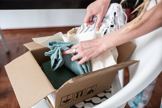 woman recieve delivery package from clothes online shop 