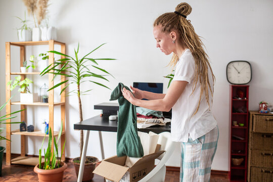 woman recieve delivery package from clothes online shop 