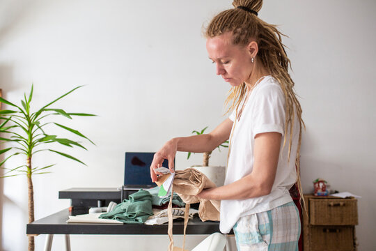 woman recieve delivery package from clothes online shop 