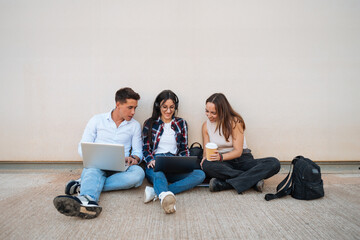 Group of university students using laptops