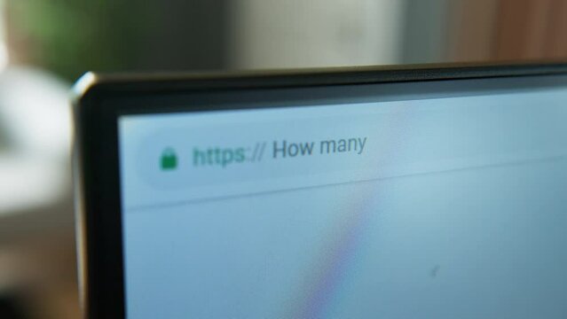Close-up shot of a computer screen displaying the search query "How many days until Christmas?". The anticipation and excitement of the holiday season, technology for information and countdowns.