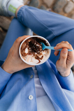 woman enjoying Argentinian dulce de leche gelato ice cream.