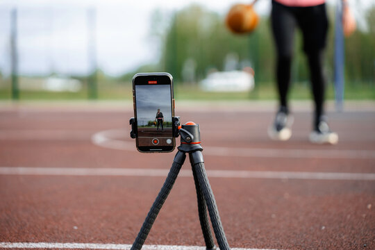 A mobile phone records a basketball game