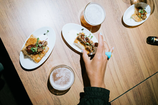 Friends Enjoying Tapas and Drinks